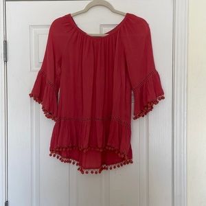 This coral pink, optional off the shoulder shirt is super cute and fun!